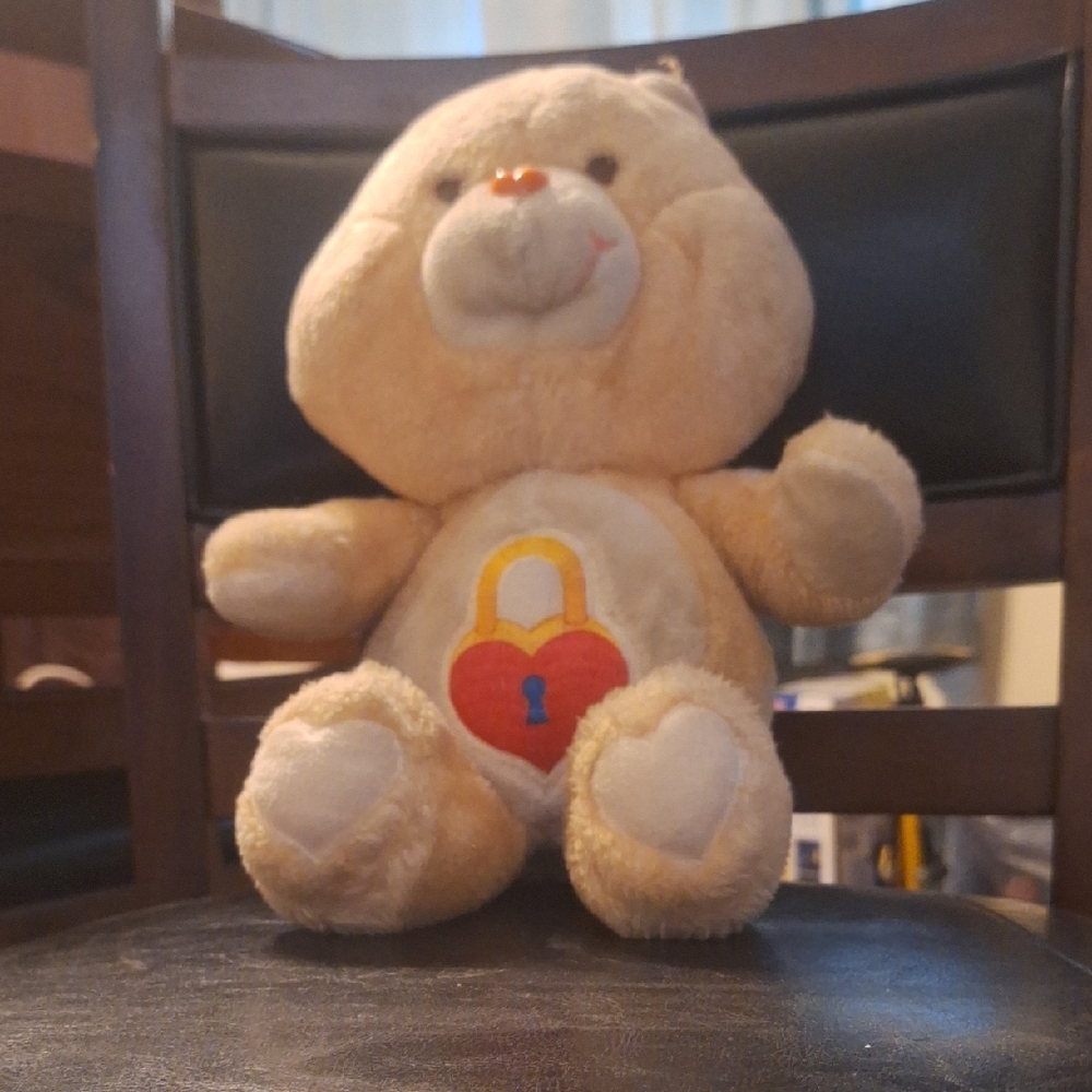 Plush Teddy Bear with Heart Lock Design